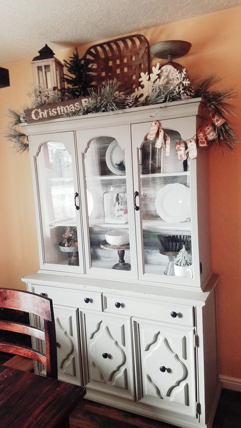 Decorate Top Of Curio Cabinet, Decorating Above China Cabinet, Top Of Curio Cabinet Decor, What To Put On Top Of China Cabinet, Top Of Hutch Christmas Decor, Decorating Top Of China Cabinet, Decor On Top Of China Cabinet, Decor On Top Of Armoire, Decorating Top Of Hutch Farmhouse