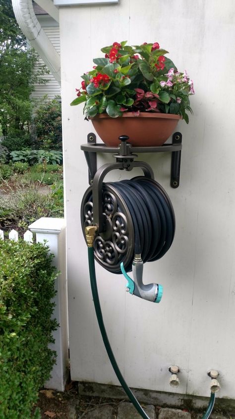 Liberty Garden 710 Navigator Rotating Garden Hose Reel, Holds 125-Feet of 5/8-Inch Hose - Bronze Patio Hose Storage, Hose Reel Ideas Wall Mount, Hose Storage Garage, Outdoor Hose Storage Ideas, Diy Garden Hose Reel, Hose Hanger Ideas, Hose Reel Ideas Diy, Garden Hose Holder Ideas, Water Hose Holder Ideas