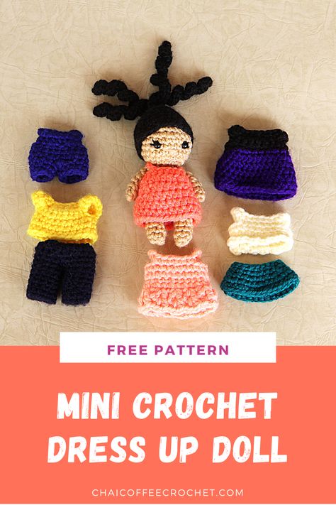 Mini crochet doll with a ponytail wearing a coral sundress. Next to her, there are two crochet dresses, one crochet skirt and blouse, a crochet tshirt and crochet pants, and a pair of crochet overalls which are included in the free pattern. Crochet Tiny Doll Clothes, Crochet Doll And Clothes, Crochet Doll With Clothes Free Pattern, Crochet Dress Up Doll, Crochet Pretend Play, Crochet Toy Clothes, Crochet Doll Dress Pattern, Crochet Dollhouse Accessories, Crochet Mini Doll Free Pattern