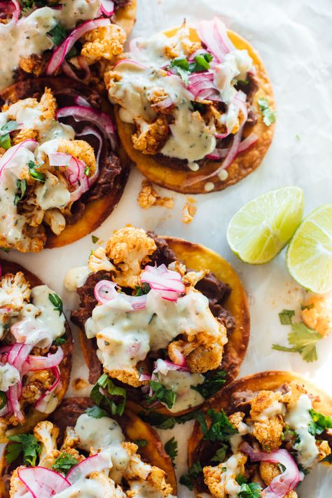 Tangy, creamy, crunchy, smoky, seasoned vegetarian goodness on a perfectly crisp little corn tortilla disk. Cauliflower Black Bean Tostadas to the rescue! #tostada #vegetarianrecipe Cauliflower Black Bean, Turkey Tostadas, Black Bean Tostadas, Bean Tostadas, Canning Refried Beans, Tostada Recipes, Pickled Onion, Pre Cooked Chicken, Corn Tortilla