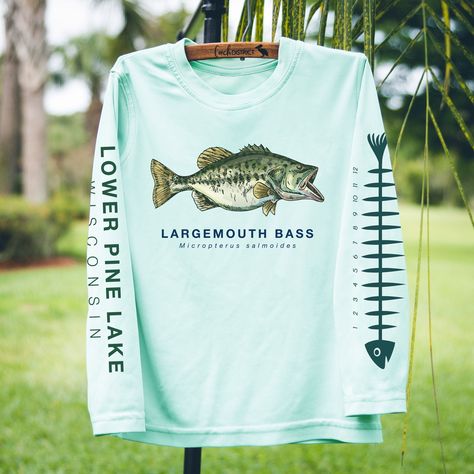 Personalize this tee, with your favorite lake! Long Sleeved Solar Tee *available in Pearl Gray, Seagrass Green, Arctic Blue, White, & Pale Yellow * Toddler, Youth, Ladies, & Mens sizing! (see size charts in additional photos) * UPF+ 50 * Lightweight, comfortable, and sure to keep the suns rays from penetrating through to your skin! * 4.1oz. spun polyester fabric is powered by PURE-tech™ moisture wicking technology. **Please check our processing time in our shop policies** Rush processing Bass Fishing Shirts, Largemouth Bass Fishing, Family Cruise Shirts, Camper Camping, Pearl Gray, Largemouth Bass, Arctic Blue, Small Lady, Sun Shirt