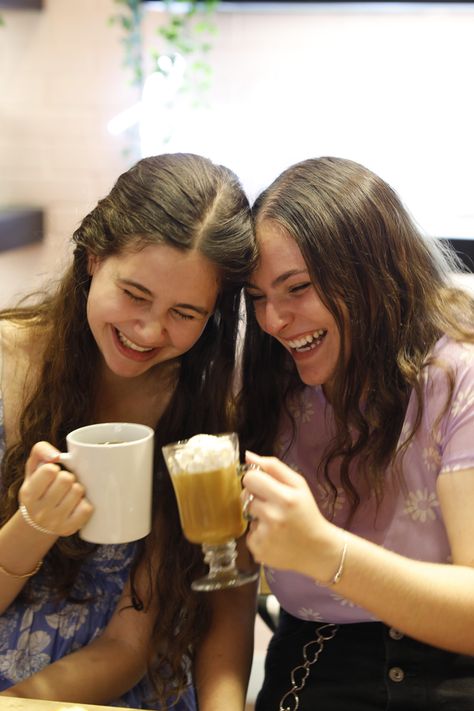 two girls laughing over café drinks Tea Branding, Coffee Party, Mate Tea, Sipping Tea, Coffee With Friends, Branding Inspo, College Experience, Tea Brands, Two Friends