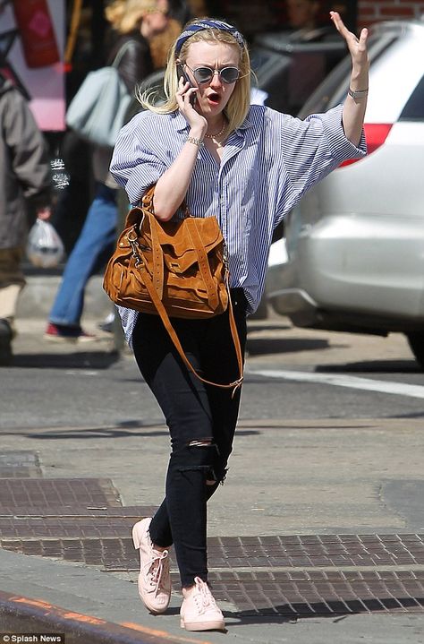 Oh no she didn't! Dakota Fanning waves her hand up in the air during a phone call on Thurs...