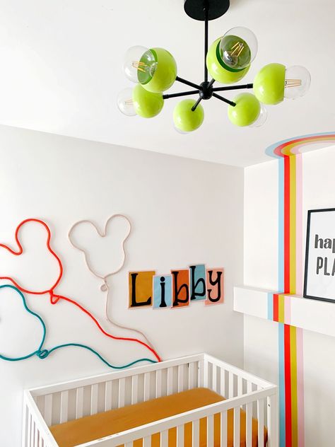 Gender neutral nursery with a modern disney mural and a neon green and black chandelier. Disneyland Nursery, Disney Playroom, Vintage Disney Nursery, Disney Mural, Disney Inspired Nursery, Disney House Ideas, Retro Disneyland, Disneyland Attractions, Disney Room Decor