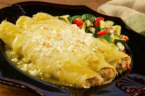 Shrimp and Crab Enchiladas | Cacique® Inc. Enchiladas Seafood, Shrimp And Crab Enchiladas, Crab Enchiladas Recipe, Crab Enchiladas, Enchiladas With Green Sauce, Seafood Enchiladas Recipe, Seafood Enchiladas, Green Crab, Shrimp Enchiladas