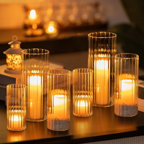 PRICES MAY VARY. Dimensions: 2.6'' x 5.9'' | 3.15'' x 7.9'' | 3.9'' x 9.8'' | Set of 6 Assorted Glass Cylinder Vase. Work well with floating candles, pillar candles and flowers. Modern Candle Vase: This glass hurricane cylinder can be used as ribbed glass vase as well as glass hurricane candle holder. Fluted glass cylinders design add a unique touch to your home. It a neutral glass pillar candle holder that shows off plants without being over stating, and is the most effective decoration for alm Cocktail Centerpieces Simple, Floating Candles Dinner Table, Wedding Candle Holders Centerpiece, Red Glass Candle Holders, Cylinder Bud Vase Centerpiece, Copper Vases Wedding, Table Candles Decor, Ribbed Glass Candle Holder, Ribbed Candle Holder