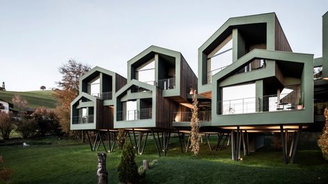 Italian studio Network of Architecture has completed an extension to a hotel in South Tyrol comprising ten gabled guest suites elevated on stilts to preserve access to the scenic grounds. Wooden Facade, Glazed Walls, Larch Wood, Hotel Building, Renzo Piano, Timber Cladding, Hotel Project, South Tyrol, Hospitality Projects