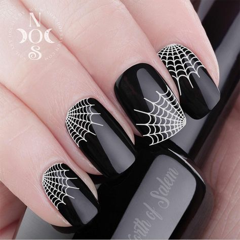 PLEASE NOTE All Decals are made in and Ship from CANADA - Shipping to the USA: please allow 14-21 days for delivery THANK YOU! 29 Black SPIDER WEB Nail Decals - Nail Art WaterSlide Transfers  These decals are black with a clear background and look great over any polish Go great mixed with my white and silver spider webs  https://www.etsy.com/listing/158862356 https://www.etsy.com/listing/186321134 Easy to apply - Includes instructions for use. 1. Paint nails with a clear base coat or a color of