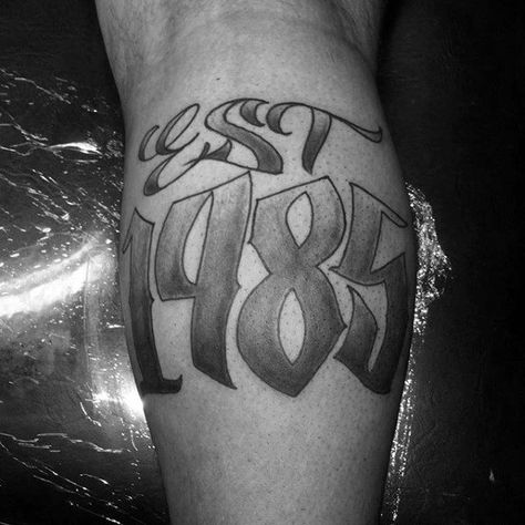 Shaded Black And Grey Ink Male Est 1985 Tattoo Design On Leg Calf Est 2000 Tattoo, 1985 Tattoo, Est Tattoos, Est. Tattoo, Guru Tattoo, Gangsta Tattoos, C Tattoo, Tattoo Apprentice, Tattoo Font