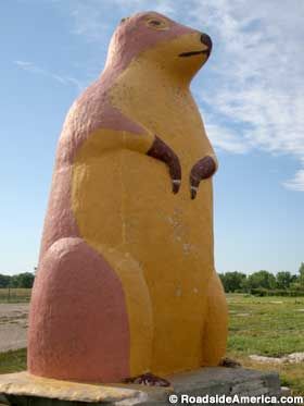 The giant concrete Prairie Dog outside the Ranch Store in Cactus Flat, South Dakota was built by Harold Zundel and set into place on July 1, 1959. We know this because Harold scratched it into the wet cement of the Prairie Dog's base, and it's still visible today. Vermillion South Dakota, South Dakota Road Trip, South Dakota Vacation, South Dakota Travel, Grand Marais, Blue Earth, Badlands National Park, Prairie Dog, Tourist Trap