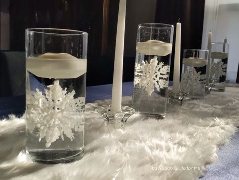 Easy Winter Centerpiece with Floating Candles and Submerged Snowflake - with DIY tutorial Winter Wonderland Snow Globes, Open Floor Plan Lighting, Winter Onederland Centerpieces, Snowflake Centerpiece, Centerpiece With Floating Candles, Snowflake Centerpieces, Dining Room Transformation, Snowflake Table, Winter Centerpiece