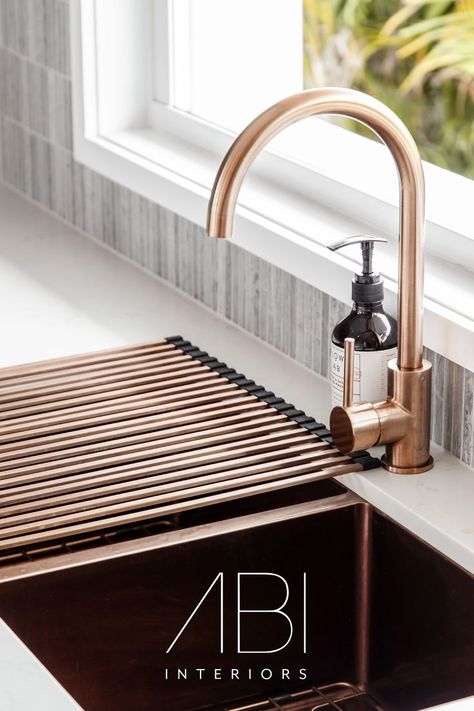 Create kitchen efficiency with the right accessories. In this space by @mkbuildingandrenovations, our brushed copper Penelope Kitchen Sink Drainer has been implemented to allow for easy and aesthetic cutlery drying. It matches the Elysian Kitchen Mixer and Zalo Double Kitchen Sink, creating a visually warm pocket of the home. Brushed Copper Kitchen, Copper Tapware, Sink Makeover, Abi Interiors, Copper Kitchen Accessories, Double Kitchen Sink, Sink Decor, Copper Taps, Laundry Room Sink