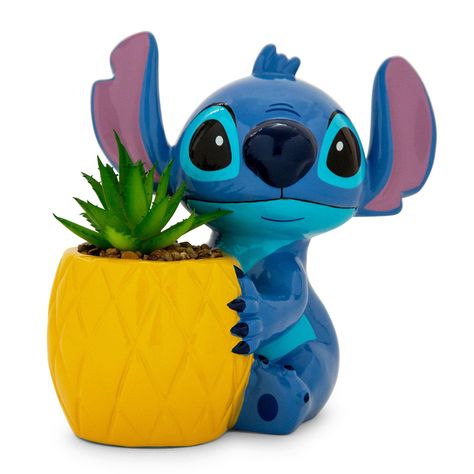 PRICES MAY VARY. MAKE A STATEMENT: Bring some style to your home or workplace with this Disney Lilo & Stitch mini-planter in the shape Stitch holding a pineapple! FAUX REAL: Planter comes with artificial plant so that way there's no upkeep necessary to reap the stylish rewards! EASY D�COR: Great way to brighten up any home, office, or magical classroom! OFFICIALLY LICENSED: Have confidence knowing you are purchasing an officially licensed Disney product from Silver Buffalo. GREAT GIFT IDEA: Purc Stitch Themed Bathroom, Clay Stitch Disney, Stitch Pineapple, Stitch Merchandise, Small Ceramic Planter, Lilo And Stitch Merchandise, Lilo Y Stitch, Lilo Et Stitch, Stitch Gift