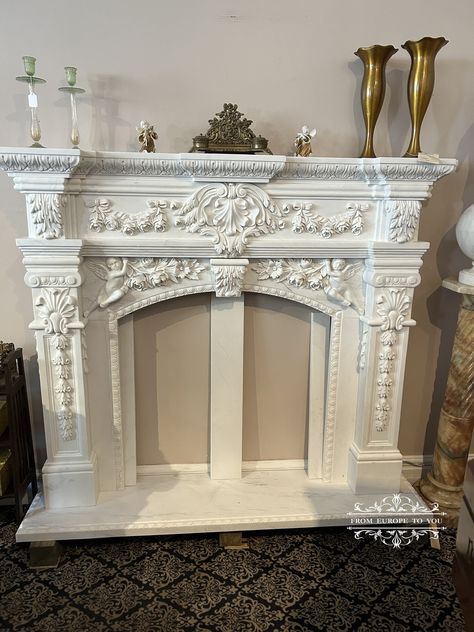 Introducing our exquisite Carved Cherub Marble Fireplace Mantel, a breathtaking addition to any home. Crafted from luxurious marble, this mantel measures 65" x 14" x 56 1/4" tall, with an opening of 35 3/4" x 34 3/4" tall, making it the perfect centerpiece for your living space. Adorned with intricately carved cherub figures, this mantel exudes elegance and sophistication. The side heights of 30 1/8" tall add to its grandeur and will instantly elevate the ambiance of any room. Bring timeless bea Ornate Fireplace, Marble Fireplace Mantle, Artificial Fireplace, Faux Mantle, Fireplace Decorating, Fireplace Marble, Victorian Ceiling, Country Fireplace, Fairy Gown