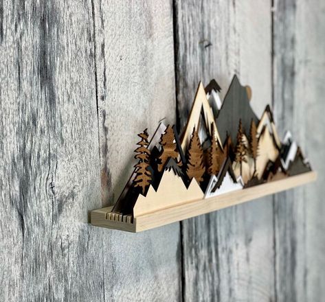 Create stunning mountain wood art sculptures that enhance your home decor. Perfect for nature lovers looking to add a touch of the outdoors to their space! Mountain Sculpture, Hood Range, 3d Forest, Mountain Wood Art, Art Shelf, Laser Cut Wood Crafts, Wood Art Projects, Mountain Decor, Art Shelves