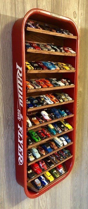 Hot Wheels Bathroom Ideas, Big Toy Car Storage Ideas, Monster Trucks Bedroom Ideas, Diy Hotwheels Display Rack, Hot Wheel Shelf, Tire Shelf Boy Rooms, Powerwheel Storage, Big Toy Truck Storage Ideas, Hot Wheel Tracks Storage