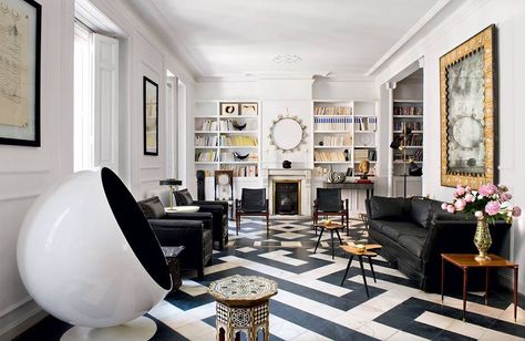 Black and White Living Room with patterned floor, picture mouldings, woodwork, crown molding, interior shutters on the floor to ceiling windows. Brilliant White Walls, White Walls Living Room, Black White Rooms, Walls Living Room, Black And White Living Room, Black And White Interior, Black And White Tiles, Styl Glamour, White Living