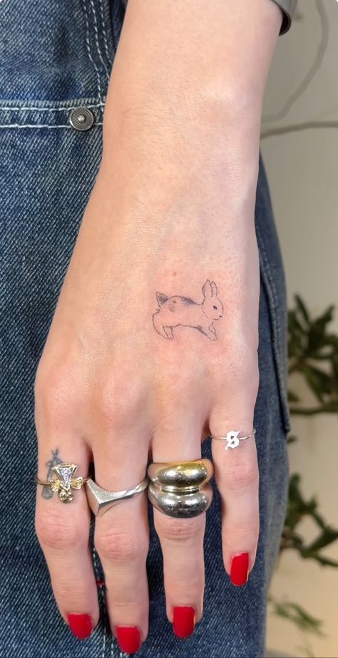 Bunny Jumping Tattoo, Rabbit Fine Line Tattoo, 1.5 Inch Tattoo Ideas, Bunny Hand Tattoo, Jumping Bunny Tattoo, Bunny Tattoo Cute, Small Rabbit Tattoo, Tiny Bunny Tattoo, Little Bunny Tattoo