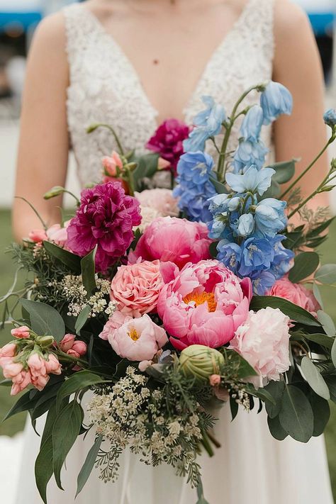 A blue and pink bridal bouquet with peonies and delphiniums. Whimsical Bridal Bouquet, Bold Bouquet, Pink Peony Bouquet, Colorful Bridal Bouquet, Pink Peonies Bouquet, Vibrant Bouquet, Blue Delphinium, Wedding Bouquets Pink, Bridal Bouquet Flowers