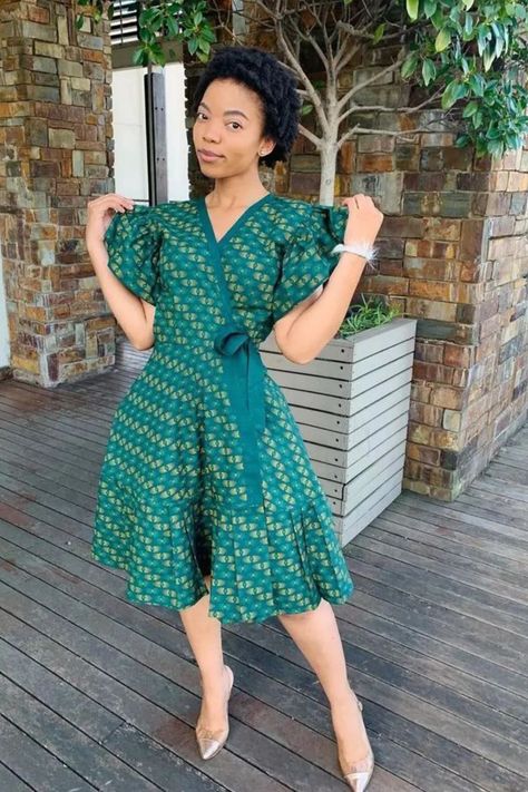 A lady wearing an Ankara wrap gown Short Dress Styles For Women, Ankara Wrap Gown Styles, Ankara Wrap Gown, Simple Ankara Dress Styles, Ankara Wrap Dress Styles, Wrap Ankara Dress, Wrap Gown Styles, Ankara Dress Styles For Ladies, Ankara Short Dress Styles