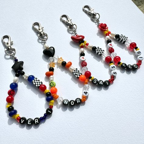 Beaded keychain charm of Formula 1 drivers. Made with colorful and unique mixture of glass, acrylic and pearl beads with each team colors. Show off your favorite driver and your love for the sport with this keychain perfect for any F1 fan like you. Add this colored beaded keychain charm to your keys, purse, bag or anywhere you desire.   Product measurement varies between each other driver due to difference in bead sizes but it is approximately 4.5 to 5 inches.  These beaded keychains are meant t Beaded Necklace Diy, F1 Racing, Racing Driver, Beaded Keychains, Bracelet Tutorial, Alpha Patterns, Diy Necklace, Pearl Beads, Formula 1