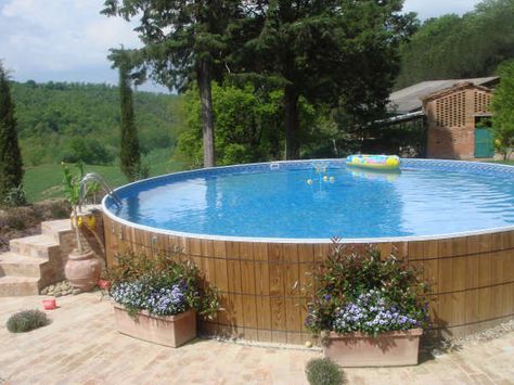 Wood lined above ground pool... I just plan to wrap it in bamboo. :) -C Best Above Ground Pool, Swimming Pool Decks, Pool Landscape Design, Above Ground Pool Landscaping, Above Ground Pool Decks, Backyard Pool Landscaping, Above Ground Swimming Pools, Pool Decor, Pool Design