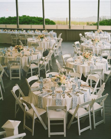 Round guest tables with paisley light blue napkins, blue water goblets and beautiful floral compote centerpieces Blue Water Goblets Wedding, Blue Goblets Table Setting, Compote Centerpiece Wedding, Floral Compote, Blue Water Goblets, Blue Goblets, Blue Table Settings, Wedding Goblets, Napkin Folds