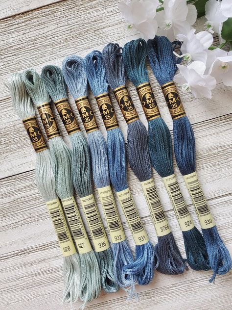 ❤ PRODUCT DETAILS ❤ DMC Set of Flosses- 8 Skeins DMC Art. 117 8 cotton skeins to inspire your next project.  Each skein measures (8m/8.7yds each) Made in France  IF WE ARE MISSING 1 SKEIN FROM THE ABOVE LIST WE WILL SEND THE CLOSEST COLOR. IF MORE THAN 1 IS MISSING YOU WILL BE CONTACTED Colors included:  924 Very Dark Green Gray 926  Medium Green Gray 927 Light Beige Gray 928 Very Light Beige Brown 930 Medium Antique Blue  931 Medium Antique Blue 932 Ultra Very Light Antique Blue 3768 Dark Beige Dmc Floss Chart, Embroidery Floss Crafts, Yarn Color Combinations, Cross Stitch Floss, Dmc Embroidery, Cross Stitch Thread, Friendship Bracelets Designs, Dmc Embroidery Floss, Embroidery Threads