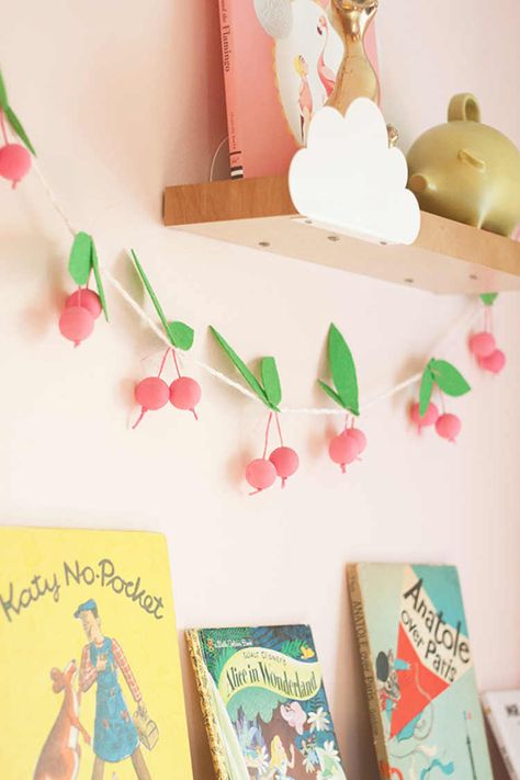 DIY Fruit Garland Cherry Garland, Bubble Gum Party, Wall Mounted Bookcase, Farmers Market Birthday Party, Fruit Garland, Origami Garland, Mounted Bookshelf, Lay Baby Lay, Shared Girls Room