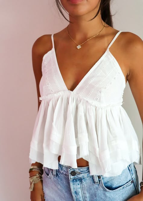 This flowy tank top is perfect for any occasion! The intricate eyelet accents add a touch of femininity and charm, making it a versatile piece that pairs effortlessly with jeans, shorts, or skirts. Whether you're dressing it up with accessories or keeping it casual, this flowy tank is your go-to for a chic and comfortable look! The Details V-Neckline Spaghetti Straps Eyelet Detailing Shell-100% Cotton Lining- 100% Polyester [#other] Hand Wash Cold Do Not Bleach Line Dry [/other] Going Out Skirts, Mini Skirt Dress, Bodycon Dresses Casual, Senior Picture Outfits, White Rock, Go With The Flow, Flare Leg Jeans, Flowy Tank Tops, Simple Trendy Outfits