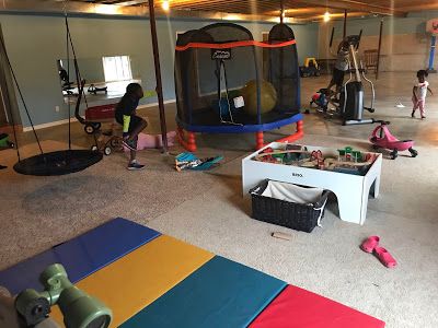 8 Must-Have Items For Your Child's Home Sensory Gym Garage Room Conversion, Sensory Gym, Gym Shed, Faux Wood Flooring, Sensory Equipment, Peanut Ball, Giant Stuffed Animals, Garage Room, Gym At Home