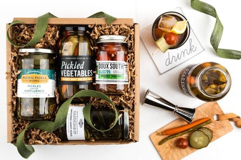 12 Gift Baskets To Wow Your Friends & Family in 2020 | Apartment Therapy Boozy Pickles, Host Gift Ideas, Quick Pickled Vegetables, Good Morning Gift, Pickle Gifts, Best Gift Baskets, Chocolate Babka, Chocolate Covered Peanuts, Cocktail Bitters