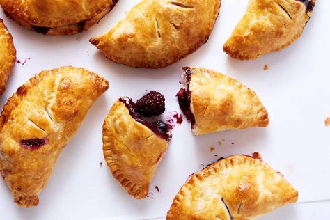 These hand-held pies are sold at breakfast time at Back in the Day Bakery in Savannah, Ga., but they are also a perfect summery dessert Cheryl Day, an owner, said that she uses less sugar than many Southern bakers do, and likes to round out the flavor of sweet summer fruit with salt and lemon. The difference between a hand pie and a turnover is in the shape (Hand pies are half moons, and turnovers are triangles.) You can make this recipe either way. Berry Hand Pies, Hand Pie Recipes, Kabocha Squash, Hand Pie, Recipe Email, Flaky Pie Crust, Nyt Cooking, Hand Pies, Breakfast Time