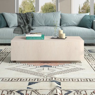 This 47'' coffee table makes a contemporary statement in your living room with its sleek, block-shaped silhouette. Its rectangular top is made from engineered wood with a solid hue that accents its clean lines and plinth base. With a weight capacity of 200 lbs. it's a stylish spot to display your favorite decorative items or serve up some appetizers when entertaining. We love that this coffee table is easy to maintain: Just wipe it down with a damp cloth to keep it looking fresh. Pair it with ma Rectangle Coffee Tables, Extendable Coffee Table, Solid Coffee Table, Coffee Table Rectangle, Nursery Furniture Sets, Coffee Table Wayfair, Modern Coffee Table, Rectangular Coffee Table, Cabinets For Sale