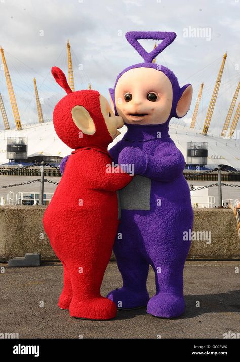 Download this stock image: Po (left) and Tinky Winky of the Teletubbies close to the O2 Arena, London. - GC0EWX from Alamy's library of millions of high resolution stock photos, illustrations and vectors. Tellie Tubbies, The Teletubbies, O2 Arena London, Tinky Winky, O2 Arena, Farmhouse Exterior, Couple Cartoon, Stock Photography, Photo Image