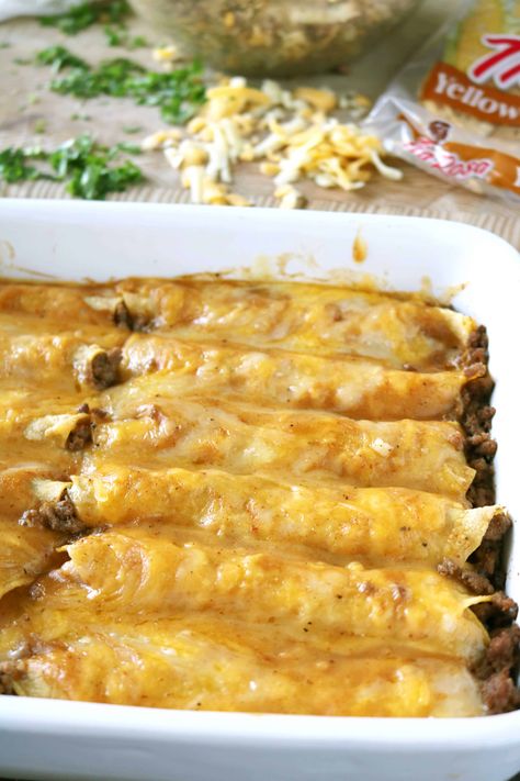 Half of a rectangular baking dish of cooked beef Enchiladas. In the background is a package of yellow corn tortillas, shredded cheese and diced cilantro. Homemade Beef Gravy, Enchiladas Beef, Beef Enchiladas Recipe, Best Enchiladas, Beef Enchilada Recipe, Ground Beef Enchiladas, Beef Enchilada, Chicken And Beef, Recipe Beef