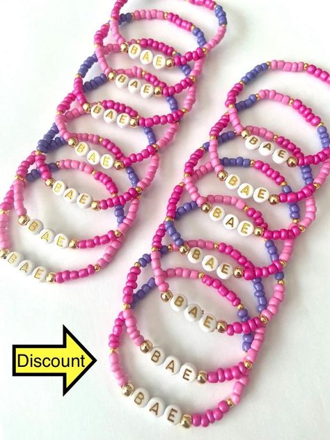 Gift letter design bracelet, optional name and text written on it, made in desired colors and desired size. Ready to ship in 10pcs - 200pcs 1-3 business days 200 pcs - 500 pcs 3-5 business days 500 pcs - 1000 pcs 1 week Bead letter color ? Beads color option ? Personalization ? Bracelet size ? Please specify in your order CARE TIPS: - Do not expose jewelry to water - Handle and store jewelry gently - Roll bracelets instead of stretching the band to wear Please These bracelets are 100% Handmade. Bracelets Taylor Swift, Gift Letter, Store Jewelry, Design Bracelet, Letter Gifts, Gift Design, Color Beads, Letter Design, Summer Bracelets