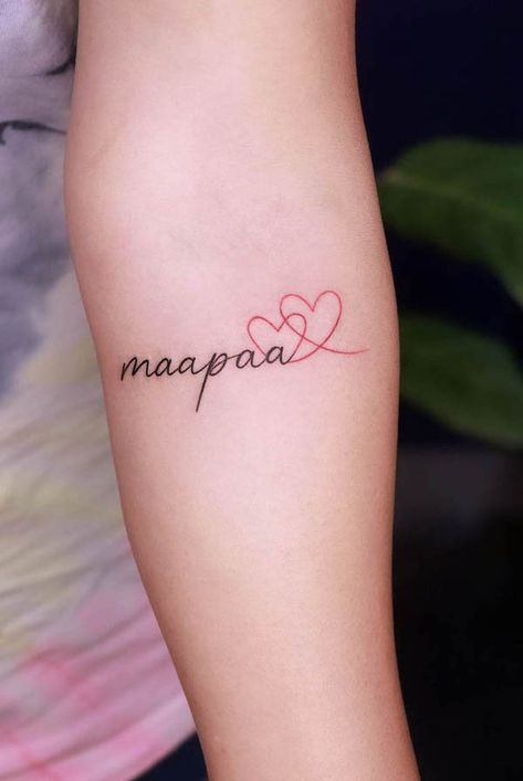 38 Mom Dad Tattoos To Honor Their Love Mom Dad Tattoo Designs For Female, Family Heart Tattoo Ideas, Maa Paa Tattoo Design For Women, Mom Dad Daughter Tattoo, Tattoo Parents Mom And Dad, Mum And Dad Tattoos For Women, Maapaa Tattoo Design, Mom And Dad Tattoo For Daughter, Mom Dad Tattoo Design Small