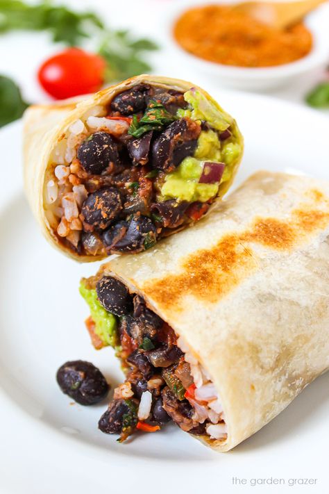 This easy meatless Black Bean Burrito recipe can be made mild or spicy! It's protein-rich plus you can customize with your favorite toppings. Vegan Bean Burrito, Black Bean Burrito Recipe, Bean Burrito Recipe, Vegan Weeknight Meals, Vegan Avocado Recipes, Burrito Vegan, Garden Grazer, Black Bean Burrito, Vegan Bean