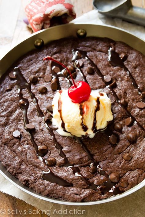 This rich and decadent skillet brownie is topped with ice cream and chocolate sauce for the ultimate dessert! Recipe on sallysbakingaddiction.com Skillet Brownie Recipe, Skillet Desserts, Skillet Brownie, Ultimate Brownies, Iron Skillet Recipes, Sally's Baking, Brownie Recipe, Skillet Meals, Chocolate Craving