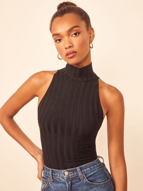 Bye sleeves. This is a slim fitting bodysuit with a turtleneck and no sleeves. The Isabel pairs well with the Cynthia High Relaxed Jean. No Sleeve Turtleneck Outfit, Turtleneck No Sleeves, Mary Dress, Knitted Turtleneck, Turtleneck Outfit, Elegant Outfits, High Neck Tank Top, Travel Outfits, High Neck Tank