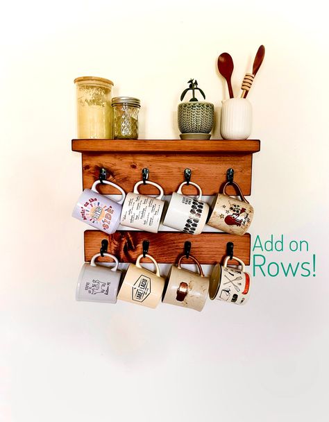 "Wall mounted coffee mug holder will let you display your mugs in clean style while also offering a shelf to store coffee, cups, décor and any other coffee bar accessories you have.  This ones for the mug lover with 8 sturdy hooks in the 2 piece combo.  Need more hooks?  Add on rows of the lower piece 4 cup hook holder.  The best part is, more cabinet space! Clean design elements allow this shelf to fit aesthetics ranging from, rustic, farmhouse, minimalist to modern.  Available in 3 finishes. Diy Coffee Mug Holder, Mug Shelf, Coffee Bar Accessories, Coffee Mug Holder, Auburn Brown, Mug Display, Shelf Holders, Mug Holder, Wood Wax