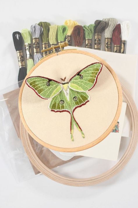 Challenge yourself with this luna moth stumpwork and thread painting embroidery kit! This kit comes with all the embroidery supplies you need, including detailed digital instructions. All levels of stitchers should be able to complete it, but some embroidery experience is recommended due to the time it takes and the complexity of the design. The kit comes in a nice cardboard box with tissue paper and is perfect for gifting. This kit includes: -size 10 embroidery needle -6 inch diameter hoop made Lunar Moth Embroidery, Luna Moth Embroidery, Embroidered Moths, Thread Painting Embroidery, Moth Embroidery, Stumpwork Embroidery, Levi Jacket, Crafting Wire, Painting Embroidery