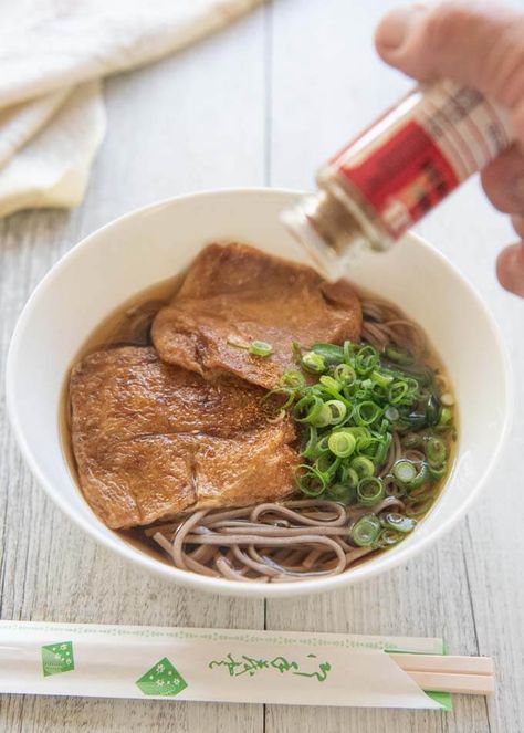 Hero shot of Kitsune Soba, with shichimi tōgarashi being scattered. Soba Recipe, Vegan Noodle Soup, Soba Noodles Soup, Udon Noodle Soup, Buckwheat Noodles, Asian Soup, Fried Tofu, Noodle Recipes, Asian Cooking