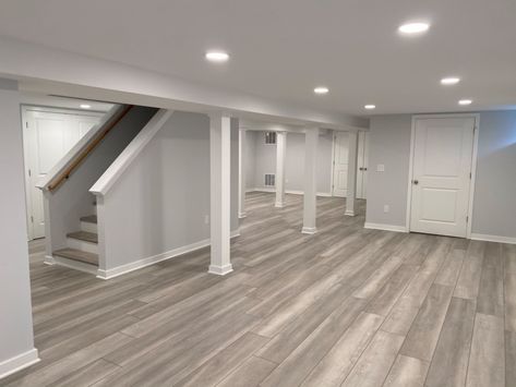 Basement Layout Stairs In Middle, Grey And White Basement, White Finished Basement, Light Grey Basement, Fully Finished Basement, Light Grey Basement Walls, Small Basement Paint Colors, Basement Floor Plans Layout, Basement Studio Apartment