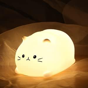 "Cat Night Light with long-life battery and soft silicone material. Soft brightness and 7 color changes. Adorable whale design. Perfect for kids' bedrooms."#CatNightLight #KidsNightLight #NurseryLamp #LEDNightLight #SoftBrightness #BreathingColor #BabyNightLight #WhaleDesign #BedtimeEase #DiaperChanging #Breastfeeding #AdorableDesign Toddler Night Light, Kids Lighting Bedroom, Lamp Cute, Cat Nursery, Cat Night, Cat Lamp, Cute Night Lights, Nursery Lighting, Kids Lamps