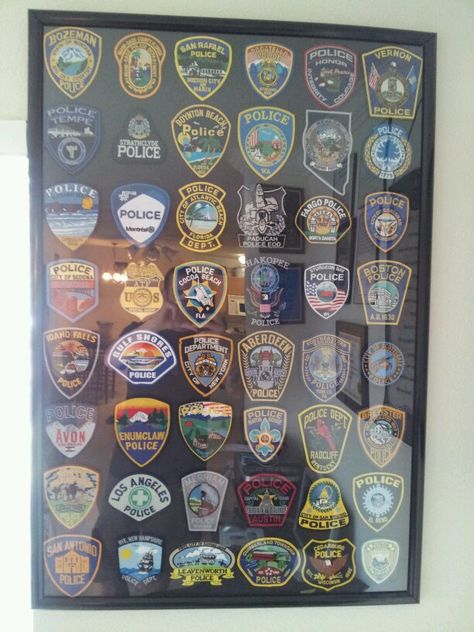 Police patch collection Police Patches Collection Display, Police Badge Display Ideas, Police Patch Display Ideas, Police Patches Display, Patch Display Ideas, Morale Patch Display, Patch Display, Firefighter Home Decor, Army Decor