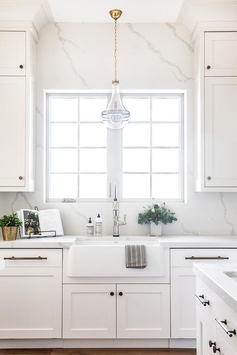 White Kitchen With Window Over Sink, Backsplash Around Window Kitchen, Quartz Kitchen Backsplash, Backsplash Around Kitchen Window, Quartz Slab Backsplash, Kitchen Slab Backsplash, Slab Backsplash Kitchen, Quartz Backsplash Kitchen, Lighting Over Sink