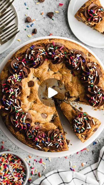 Lauren Allen on Instagram: "This, my friends, is a COOKIE CAKE! 🍪 
It’s basically a glorious giant cookie baked in a cake pan—perfect for birthdays or whenever you need some chocolate chip goodness in your life. 💛

Google “TBFS Cookie Cake” or comment below, and I’ll DM it to you! 💌

Soft and chewy in the center, crispy on the edges, and loaded with chocolate chips. What’s not to love? Sometimes a giant cookie is all you need. 

👇🏼SIMPLIFIED RECIPE👇🏼
Mix 12 Tbsp melted butter, 1 cup light brown sugar, and 1/2 cup granulated sugar until well blended. Add 1 egg, 1 egg yolk, and 2 tsp vanilla. Stir in 2 cups + 2 Tbsp flour, 1/2 tsp baking soda, and 1/2 tsp salt. Fold in 1 1/2 cups chocolate chips. Press dough into a 10-12 inch skillet. Bake at 350°F for 35-40 minutes. Cool completely. How To Make A Cookie Cake, Make A Cookie Cake, Cookie Cake Decorating Ideas, Giant Cookie, Soft Cookie, Cake Pan, Birthday Cookies, Egg Yolk, Cookie Cake