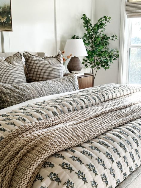 Bedding With Quilt And Comforter, Bedroom Ideas Quilt, King Bed Cozy, Western Farmhouse Aesthetic, English Cottage Bedding Ideas, Styling Quilt Bedding, Patterned Comforter Bedroom, Printed Bedding Ideas, Taupe Wall Bedroom Ideas